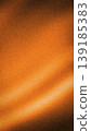 Rich vertical abstract background with a deep orange and dark brown gradient, highlighted by bright light streaks and an authentic, high-quality grainy texture 139185383