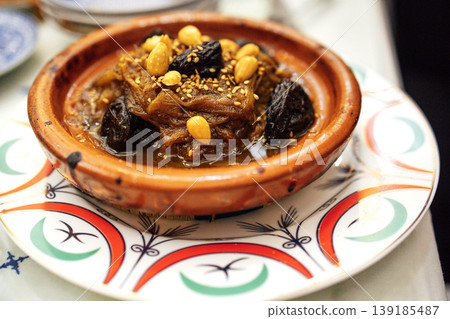 Mrouzia, Moroccan Tagine with Raisins, Almonds and Honey Mrouzia, Moroccan Tagine with Raisins, Almonds and Honey 139185487