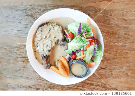 pork steak or grilled pork and salad or pork chop and vegetable pork steak or grilled pork and salad or pork chop and vegetable 139185601