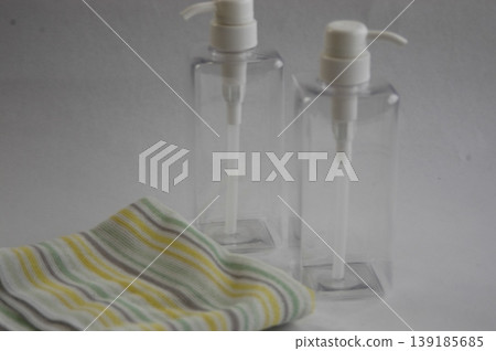 Refillable bottle and towel 139185685