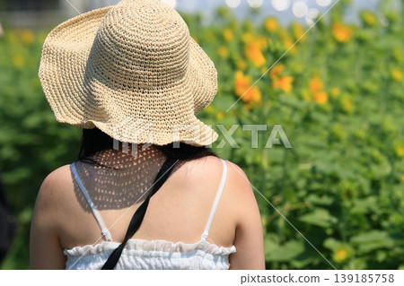 Sunflower and woman Sunflower and woman 139185758