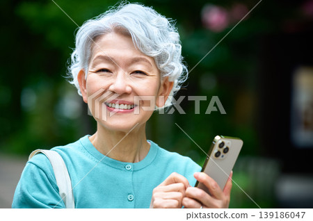 A smiling senior woman enjoying her digital life 139186047