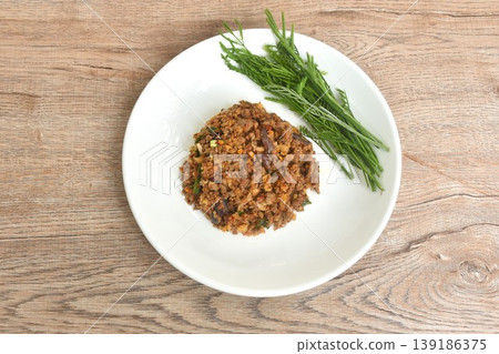 spicy fried chop catfish with herb eat couple fresh top acacia leaf Thai salad on plate spicy fried chop catfish with herb eat couple fresh top acacia leaf Thai salad on plate 139186375