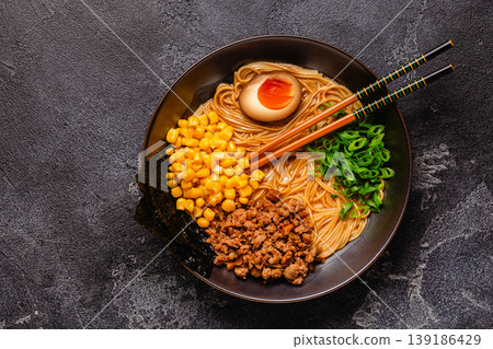 A bowl of ramen with noodles, meat and green onions. A bowl of ramen with noodles, meat and green onions. 139186429