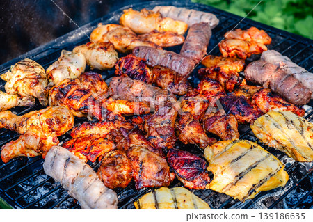 grilled meat over the coals on barbecue 139186635