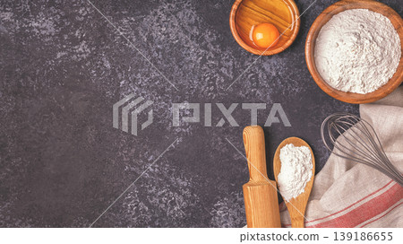 Ingredients for baking  - flour, wooden spoon, rolling pin, eggs 139186655
