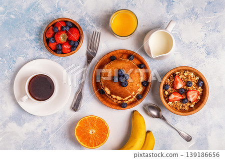 Delicious breakfast on a light table. Delicious breakfast on a light table. 139186656