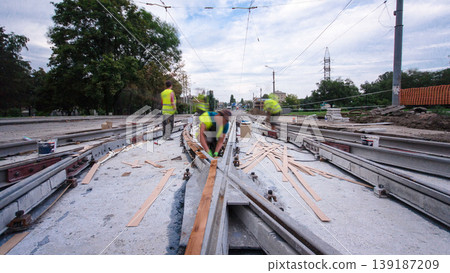 Road construction site with tram tracks repair and maintenance timelapse hyperlapse. Road construction site with tram tracks repair and maintenance timelapse hyperlapse. 139187209