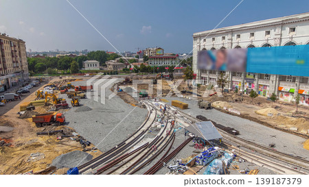Repair works on the street timelapse. Laying of new tram rails on a city street Repair works on the street timelapse. Laying of new tram rails on a city street 139187379