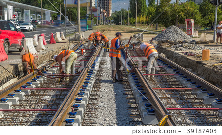 Repair works on the street timelapse. Laying of new tram rails on a city street. Repair works on the street timelapse. Laying of new tram rails on a city street. 139187403