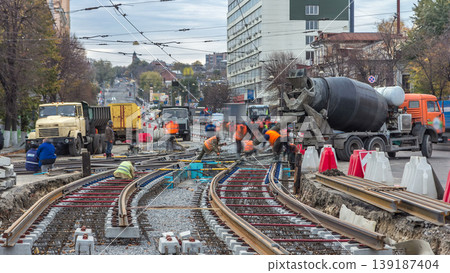 Pouring ready-mixed concrete after placing steel reinforcement to make the road by concrete mixer timelapse. Pouring ready-mixed concrete after placing steel reinforcement to make the road by concrete mixer timelapse. 139187404