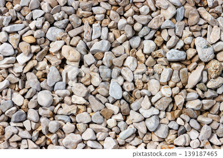 Sea pebble stone texture background top view with copy space. Sea rocks pattern Sea pebble stone texture background top view with copy space. Sea rocks pattern 139187465