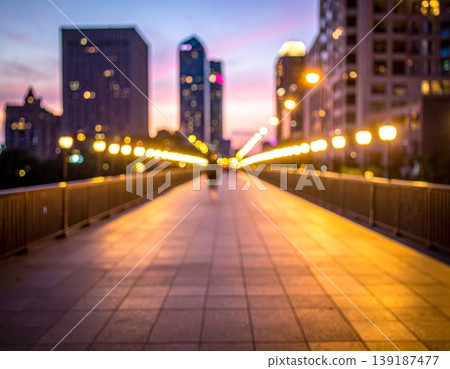 Blurry Cityscape Walkway at Dusk with Warm Lights Blurry Cityscape Walkway at Dusk with Warm Lights 139187477