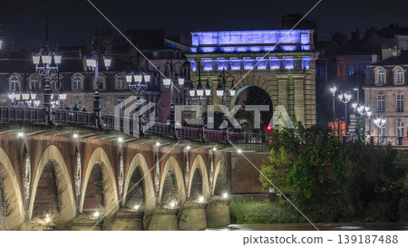 Pont de Pierre stone bridge with Porte de Bourgogne night timelapse in Bordeaux, France. 139187488