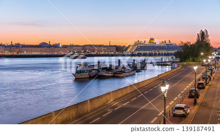 Ship and boats docked along the Garonne River day to night timelapse in Bordeaux, France Ship and boats docked along the Garonne River day to night timelapse in Bordeaux, France 139187491