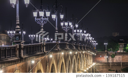 Pont de Pierre timelapse at night, Stone Bridge in Bordeaux, spans the Garonne River Pont de Pierre timelapse at night, Stone Bridge in Bordeaux, spans the Garonne River 139187515
