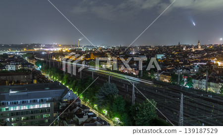Aerial night timelapse of Brussels North station railway tracks with trains arriving and departing. Belgium Aerial night timelapse of Brussels North station railway tracks with trains arriving and departing. Belgium 139187529