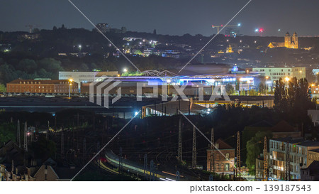 Aerial night timelapse of Brussels North station railway tracks with trains arriving and departing. Belgium Aerial night timelapse of Brussels North station railway tracks with trains arriving and departing. Belgium 139187543