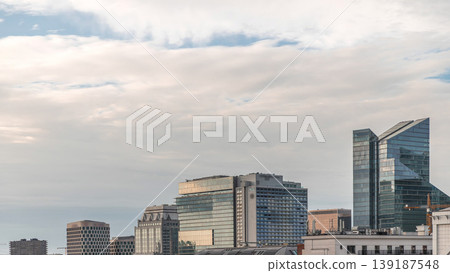Aerial timelapse of modern skyscrapers and towers in Brussels with glass facades reflecting cloudy sky. Belgium Aerial timelapse of modern skyscrapers and towers in Brussels with glass facades reflecting cloudy sky. Belgium 139187548