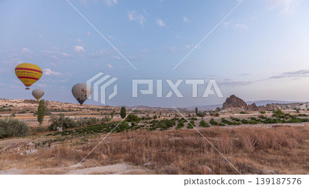 Beautiful colorful hot air balloons take off and flying in clear morning sky timelapse in Cappadocia, Turkey Beautiful colorful hot air balloons take off and flying in clear morning sky timelapse in Cappadocia, Turkey 139187576