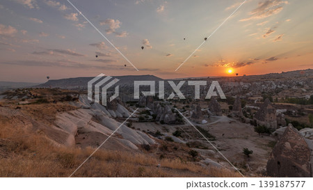 Beautiful sunrise with colorful hot air balloons take off and flying in clear morning sky aerial timelapse in Cappadocia, Turkey Beautiful sunrise with colorful hot air balloons take off and flying in clear morning sky aerial timelapse in Cappadocia, Turkey 139187577