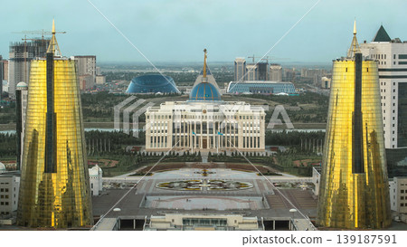 A square in front of Ak Orda with Altyn Orda business center in the foreground timelapse. Nur-Sultan city, Kazakhstan A square in front of Ak Orda with Altyn Orda business center in the foreground timelapse. Nur-Sultan city, Kazakhstan 139187591