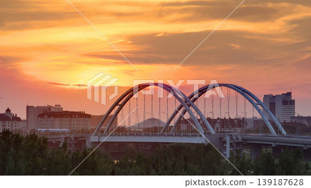 Sunset timelapse above the Bridge with the transport and clouds on the background. Central Asia, Kazakhstan, Astana 139187628