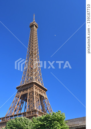 The Eiffel Tower and the moon in the daytime sky, Paris, April 23, 2026 The Eiffel Tower and the moon in the daytime sky, Paris, April 23, 2026 139187710