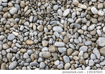 Natural Grey and Brown Sea Pebble Stones Texture Background 139187843