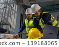 Construction workers collaborate on project industrial site photography indoor environment close-up view teamwork in action 139188065