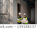 Construction site meeting between engineers urban location professional interaction indoor setting collaborative viewpoint project planning 139188137