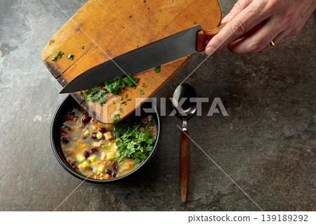 Red bean soup with potatoes, tomatoes, paprika, carrot, and bacon. 139189292