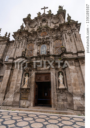 Baroque church facade with azulejo tiles and tourists in Porto Baroque church facade with azulejo tiles and tourists in Porto 139189387