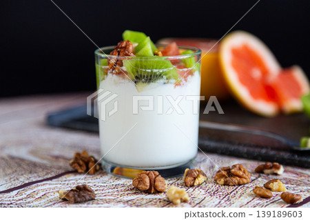 homemade yogurt dessert with fruits nuts and creamy texture homemade yogurt dessert with fruits nuts and creamy texture 139189603