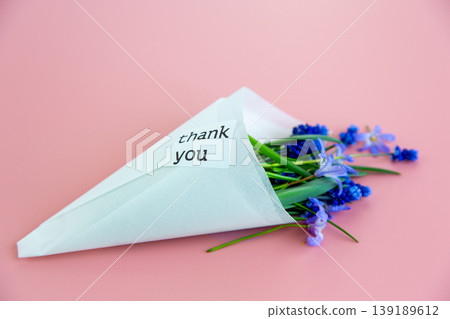 minimal spring composition with blue flowers and thank you text minimal spring composition with blue flowers and thank you text 139189612