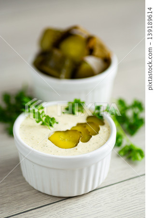 homemade creamy tartar sauce served in white ramekin bowl homemade creamy tartar sauce served in white ramekin bowl 139189614