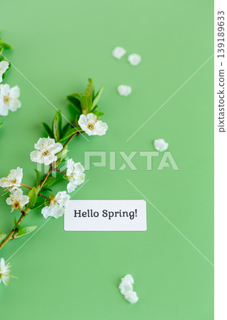 fresh spring flowers with greeting label on soft green background fresh spring flowers with greeting label on soft green background 139189633