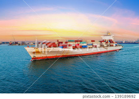 Cargo ship carrying container running for export import near cargo yard port concept freight shipping. Cargo ship carrying container running for export import near cargo yard port concept freight shipping. 139189692