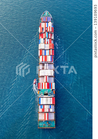Aerial view of container cargo ship in sea. Aerial view of container cargo ship in sea. 139189693