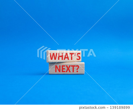 What is next symbol. Concept words What is next on wooden blocks. Beautiful blue background. Business and What is next concept. Copy space. What is next symbol. Concept words What is next on wooden blocks. Beautiful blue background. Business and What is next concept. Copy space. 139189899