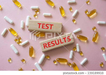 TEST RESULTS symbol. Concept word TEST RESULTS on wooden blocks. Beautiful purple background with pills. Medicine and TEST RESULTS. Copy space TEST RESULTS symbol. Concept word TEST RESULTS on wooden blocks. Beautiful purple background with pills. Medicine and TEST RESULTS. Copy space 139189910