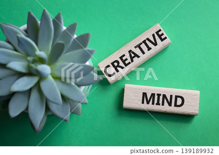 CREATIVE MIND symbol. Concept word CREATIVE MIND on wooden blocks. Beautiful green background with succulent plant. Business and CREATIVE MIND concept. Copy space CREATIVE MIND symbol. Concept word CREATIVE MIND on wooden blocks. Beautiful green background with succulent plant. Business and CREATIVE MIND concept. Copy space 139189932
