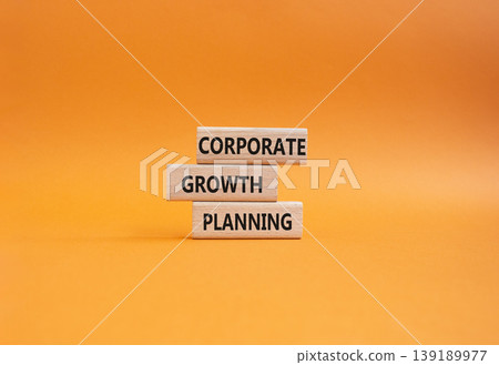 Corporate growth planning symbol. Concept word Corporate growth planning on wooden blocks. Beautiful orange background. Business and Corporate growth planning. Copy space 139189977