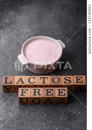 Liquid lactose free yogurt, a useful food for digestive health. Lactose free yogurt Liquid lactose free yogurt, a useful food for digestive health. Lactose free yogurt 139190461