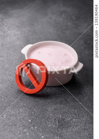 Liquid drinking yogurt with a lactose free sign, a useful food. Lactose free yogurt Liquid drinking yogurt with a lactose free sign, a useful food. Lactose free yogurt 139190464