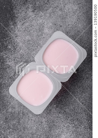 Milky liquid drinking yogurt, a useful food for healthy digestion. Drinking yogurt Milky liquid drinking yogurt, a useful food for healthy digestion. Drinking yogurt 139190500