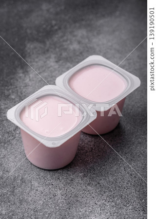 Milky liquid drinking yogurt, a useful food for healthy digestion. Drinking yogurt Milky liquid drinking yogurt, a useful food for healthy digestion. Drinking yogurt 139190501