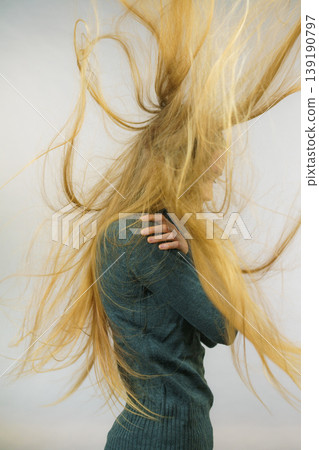 Sad girl with blowing hair Sad girl with blowing hair 139190797