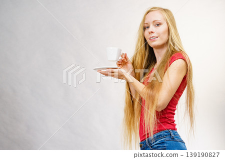 Blonde girl with coffee cup 139190827