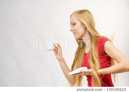 Blonde girl with coffee cup 139190828